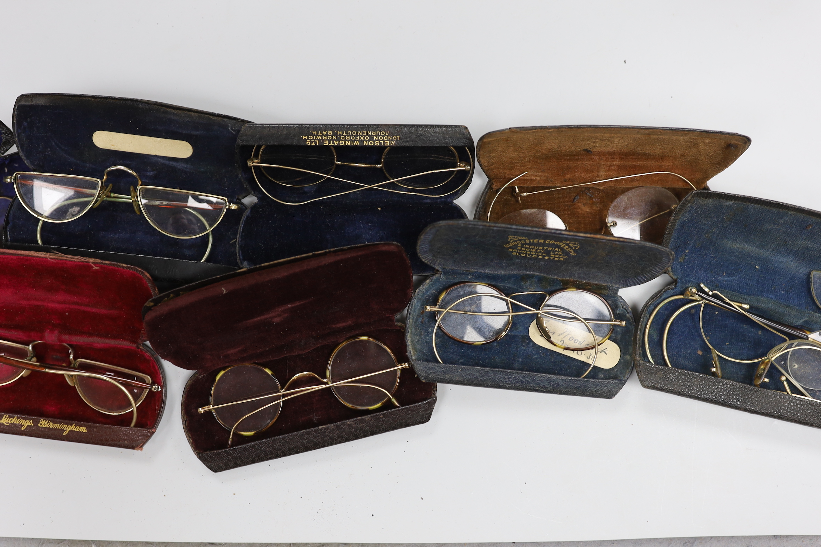 A quantity of spectacles and cases